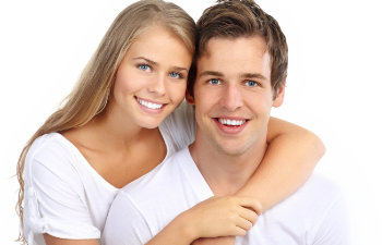 A happy young couple with a perfect smiles.