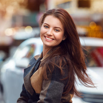 A cheerful young woman with a perfect smile.