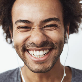 A happy young Afro-American man with a perfect smile.
