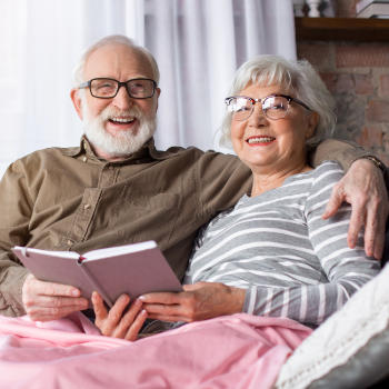 A happy smiling senior couple spending time together at home.