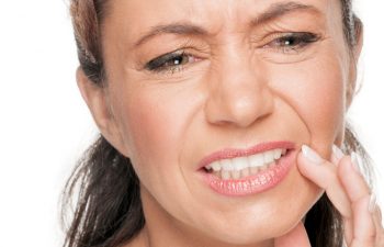 A woman suffering from dental pain