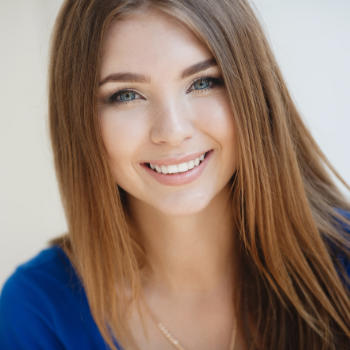 A beautiful young woman with a perfect smile.