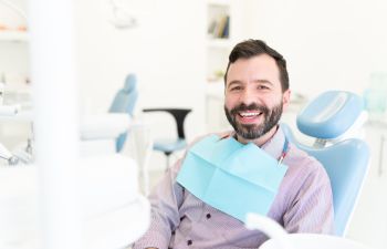 Cheerful mature man at a dental appointment.