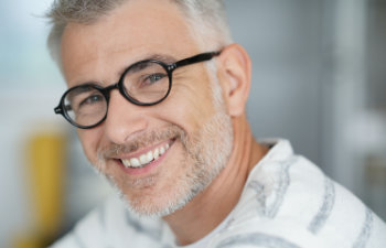 smiling middle aged man with glasses