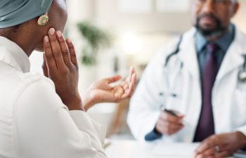 Healthcare, consulting and doctor with patient in clinic for orthopedic expert, jaw pain and tmj treatment. Medical, advice and meeting with people in hospital for insurance, feedback or test results